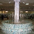 Водопады по стеклу и по прозрачным колоннам в общей водной чаше. Торговый центр "Омега" г. Ижевск.